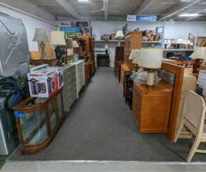 Cabinets and dressers packed on the sales floor for National Thrift Shop Day 2022
