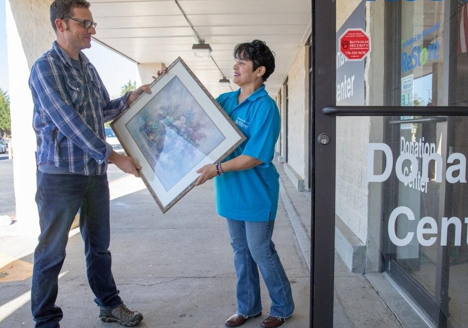 Habitat for Humanity supporter donates a picture to the Habitat ReStore